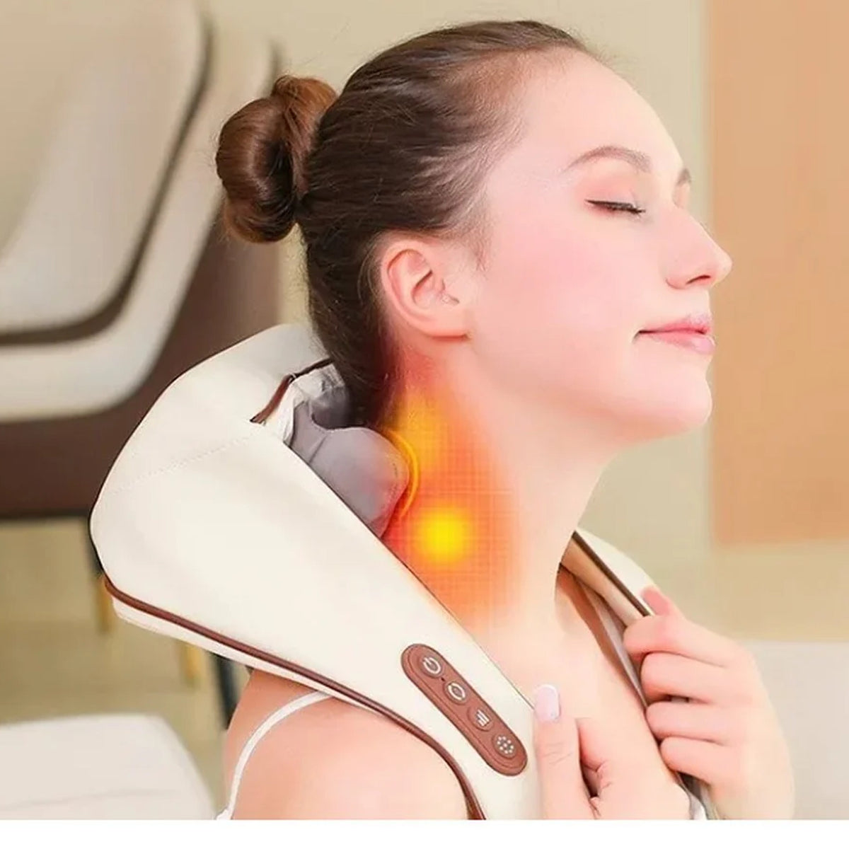 Woman relaxing with the Evenwarm cordless heated neck and shoulder massager draped over her shoulders