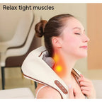 Woman relaxing with the Evenwarm cordless heated neck and shoulder massager draped over her shoulders